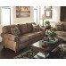 Signature Design by Ashley Larkinhurst Upholstered Faux Leather Sofa with Nailhead Trim and 2 Accent Pillows Brown