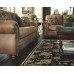 Signature Design by Ashley Larkinhurst Upholstered Faux Leather Sofa with Nailhead Trim and 2 Accent Pillows Brown